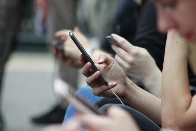 Multiple hands using mobile phone devices